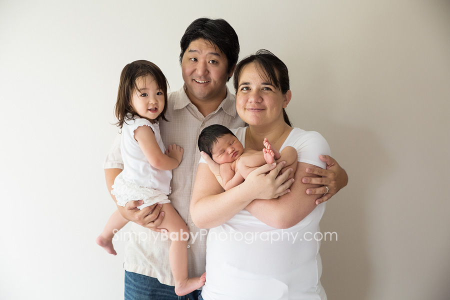Newborn family portrait Family with newborn baby